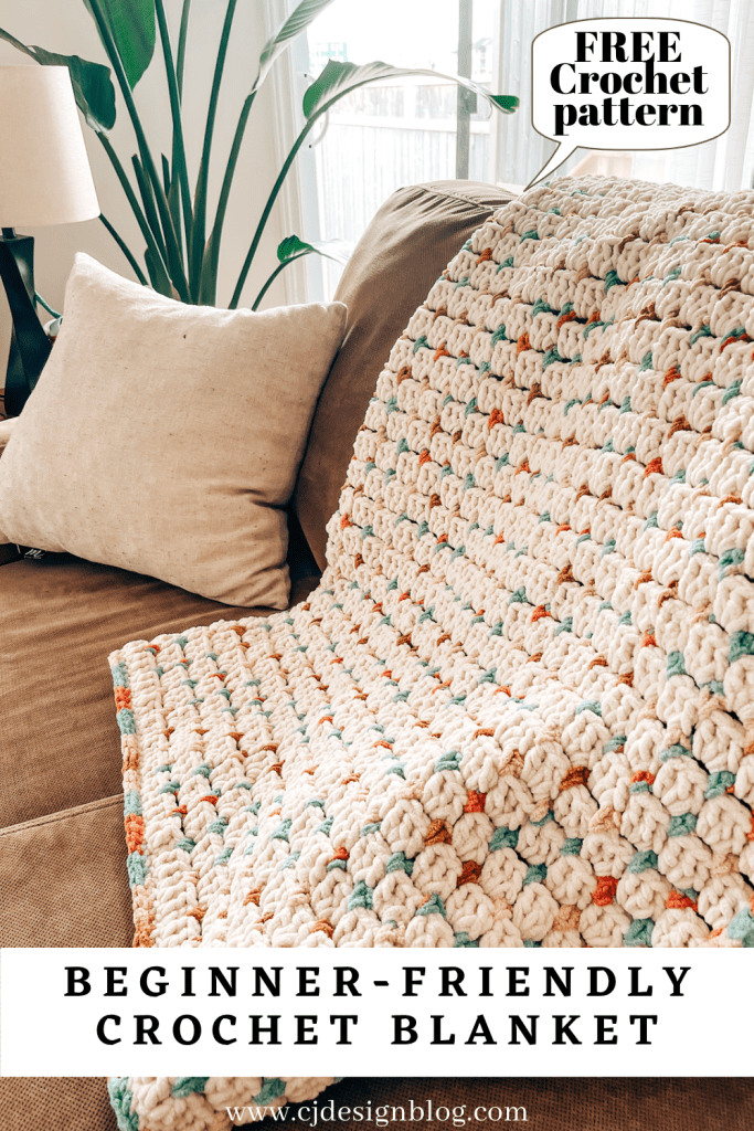 Chunky crochet blanket A Pinterest image of a chunky crochet blanket that is white with coloured dots that reads "beginner-friendly crochet blanket"